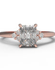 Close up of the Cluster Aria Solitaire Engagement Ring in rose gold by Fluid Jewellery