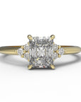 Close up of the Cluster Aria Solitaire Engagement Ring in yellow gold by Fluid Jewellery