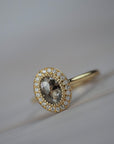 Aura halo solitaire engagement ring featuring a champagne-toned Australian salt and pepper rose-cut diamond surrounded by Canadian diamonds