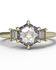 Close up of the Three Stone Alice Solitaire Engagement Ring in yellow gold by Fluid Jewellery