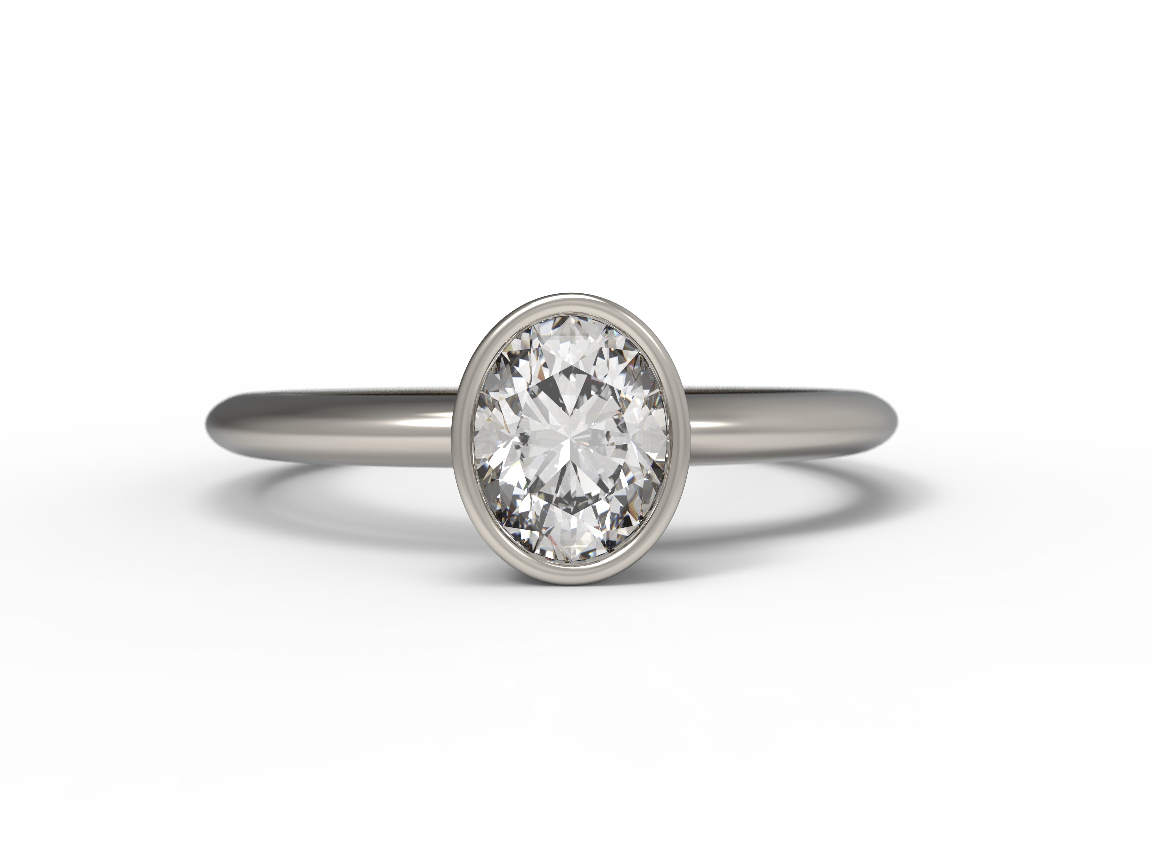 Close up of the Bezel Isla Solitaire Engagement Ring in white gold by Fluid Jewellery