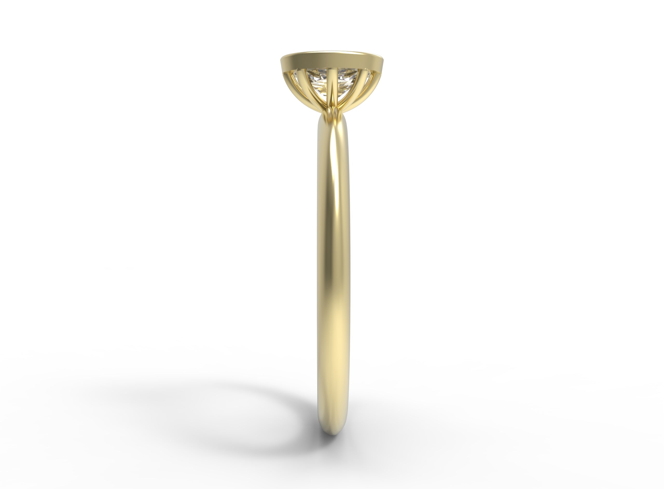 Close up of the Bezel Isla Solitaire Engagement Ring in yellow gold by Fluid Jewellery 2