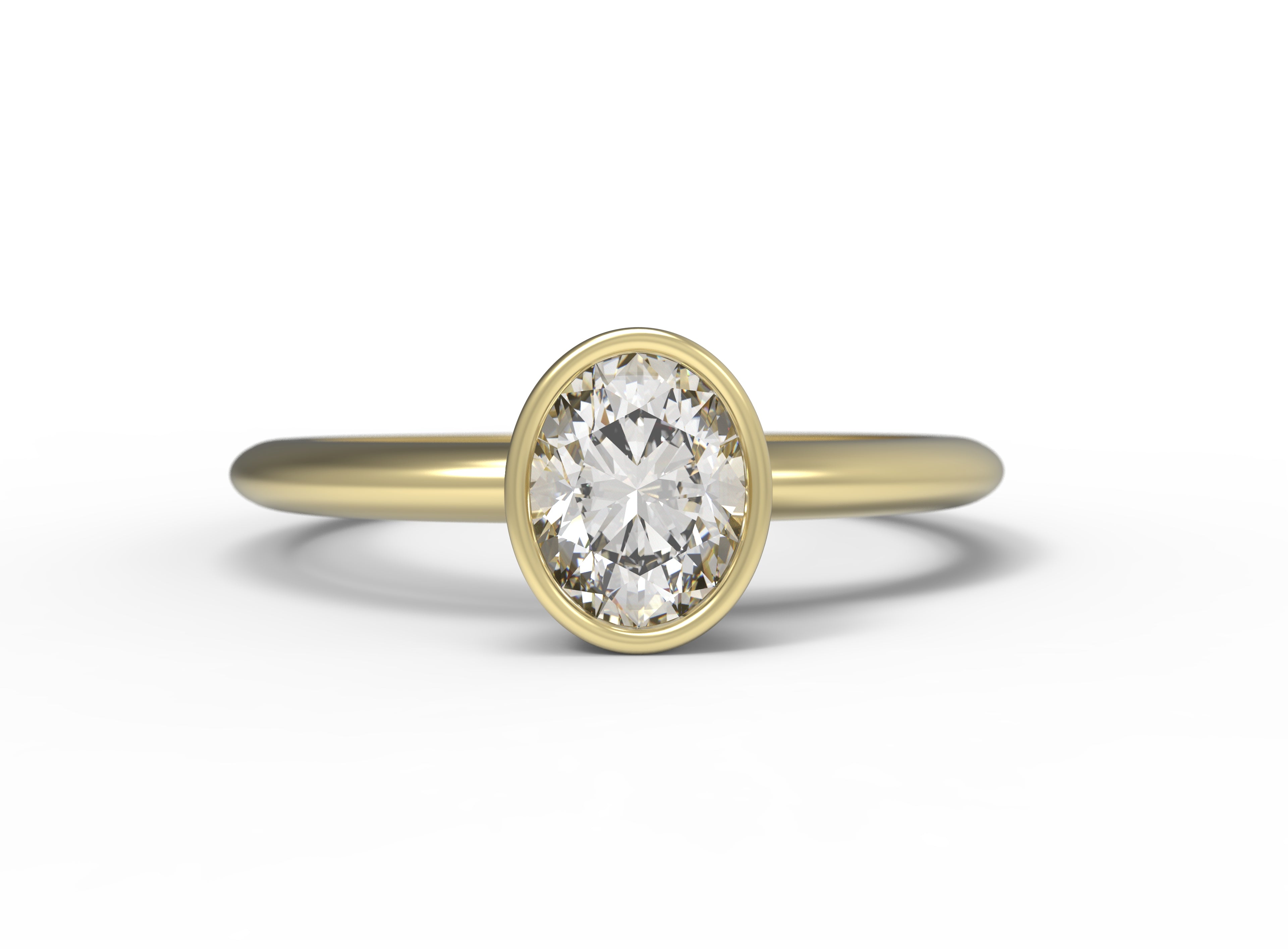 Close up of the Bezel Isla Solitaire Engagement Ring in yellow gold by Fluid Jewellery