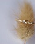 Close up of the Accented Bri Solitaire Engagement Ring in yellow gold by Fluid Jewellery 4