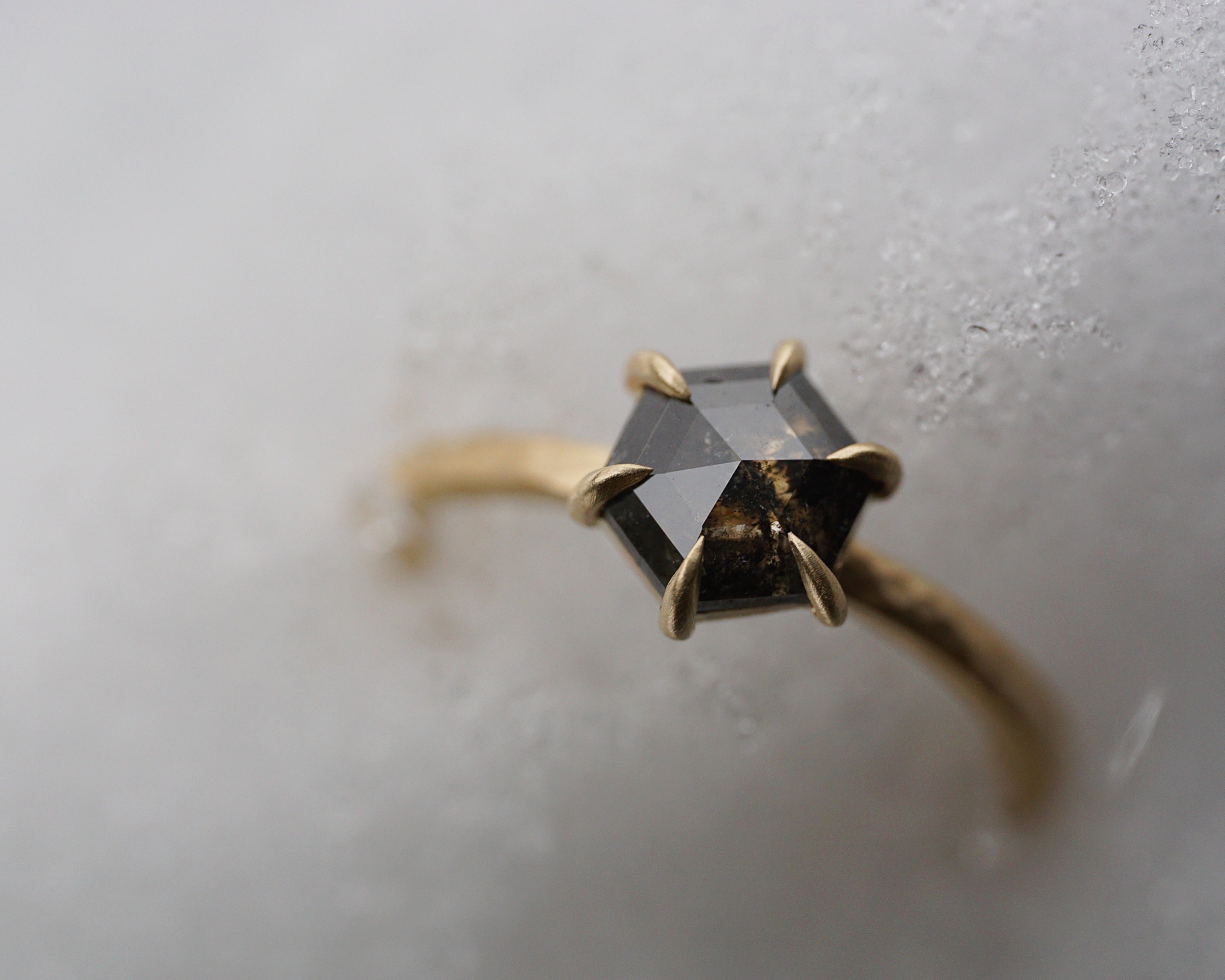 Close up of the Classic Celeste Solitaire Engagement Ring in yellow gold by Fluid Jewellery