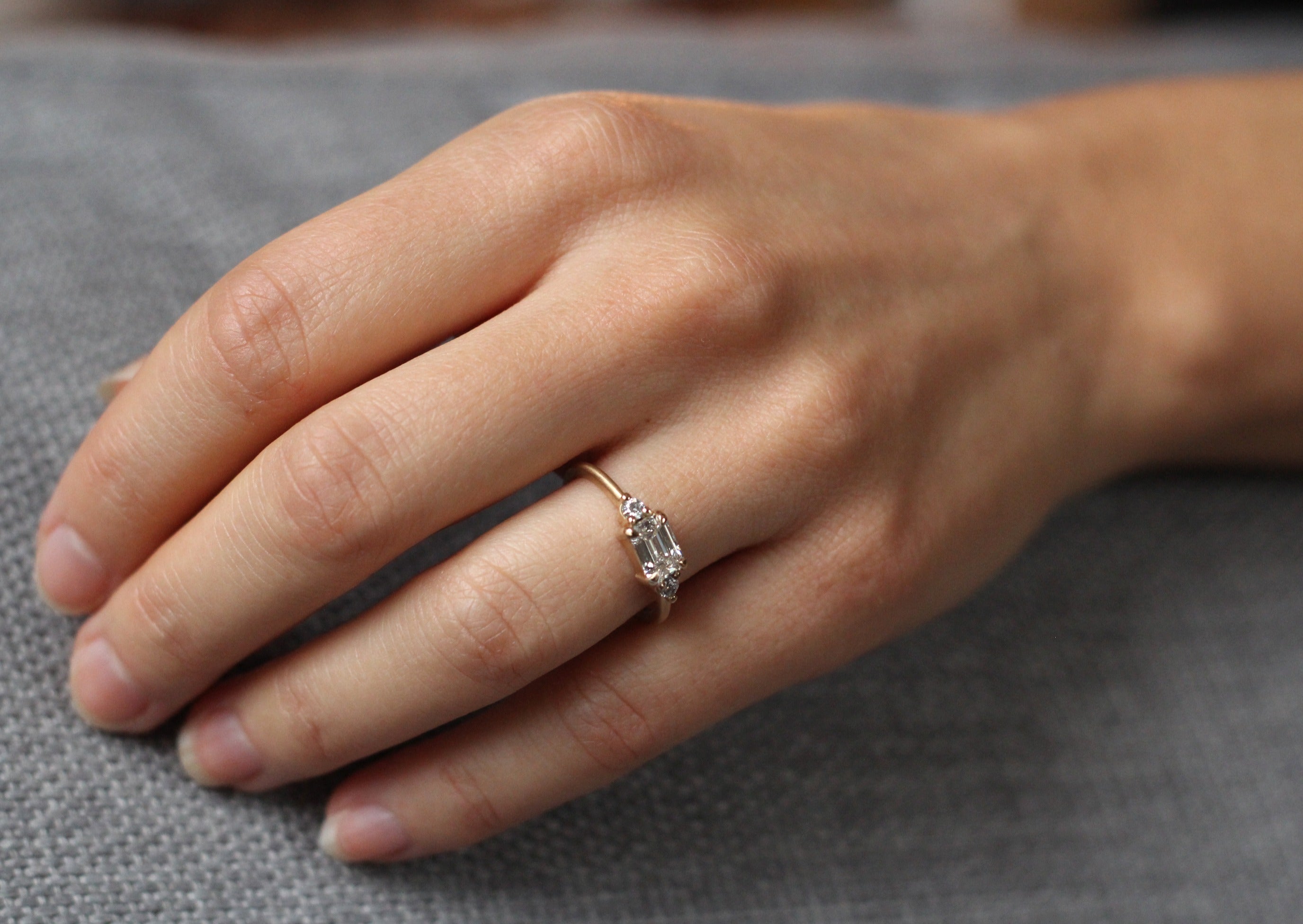 Model wearing the Five Stone Cora Engagement Ring in rose gold by Fluid Jewellery 3