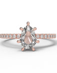 Close up of the Accented Daphne Solitaire Engagement Ring in rose gold by Fluid Jewellery