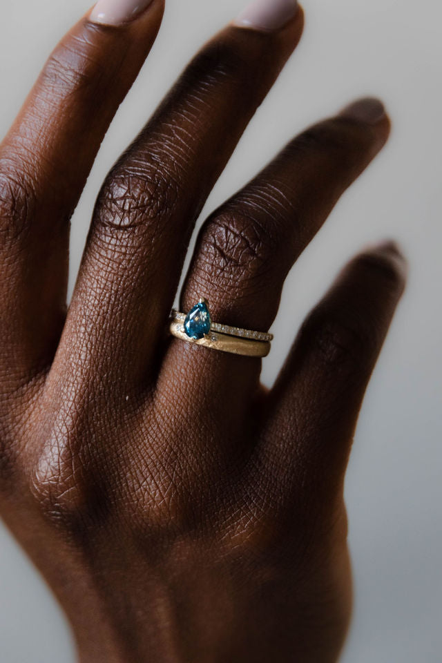 Model wearing the Accented Edith Solitaire Engagement Ring in gold by Fluid Jewellery  3