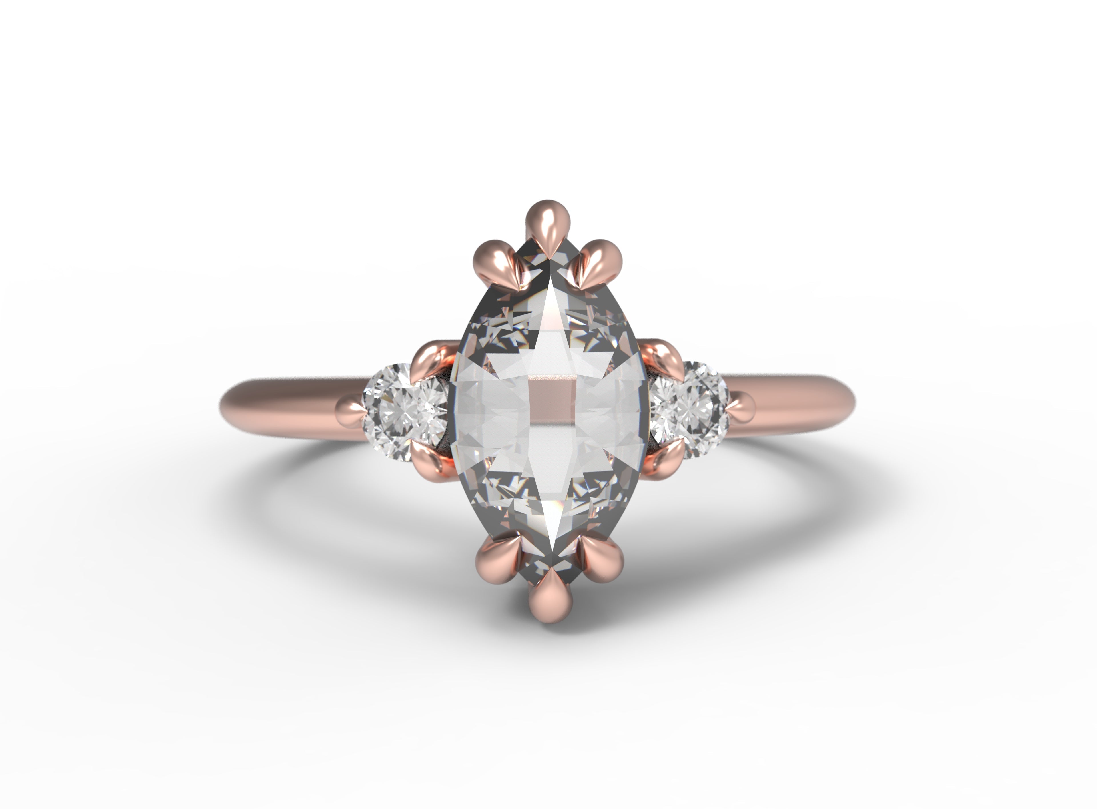 Close up of the Three Stone Elizabeth Engagement Ring in rose gold by Fluid Jewellery