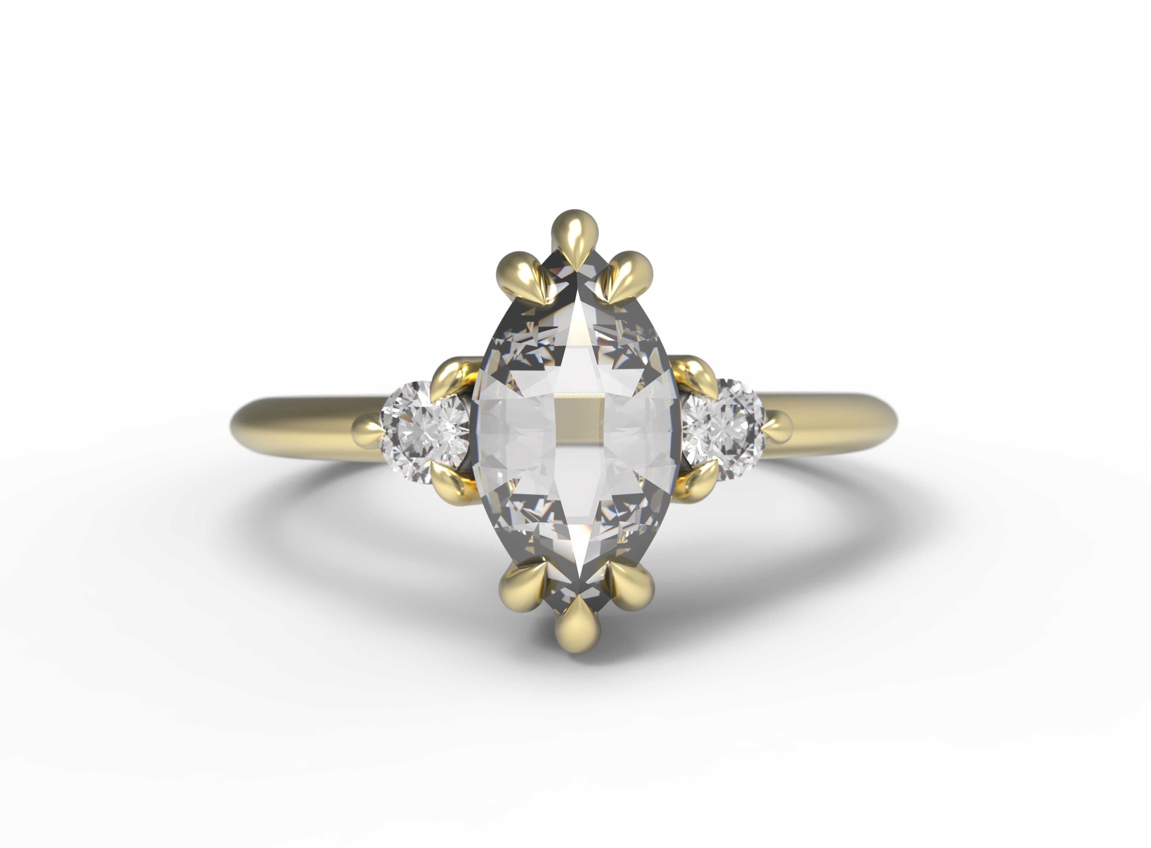 Close up of the Three Stone Elizabeth Engagement Ring in yellow gold by Fluid Jewellery 3