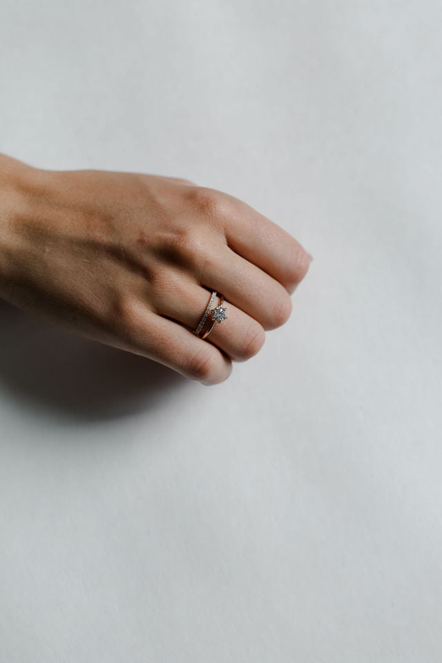 Model wearing the Classic Esther Engagement Ring in yellow gold by Fluid Jewellery 2
