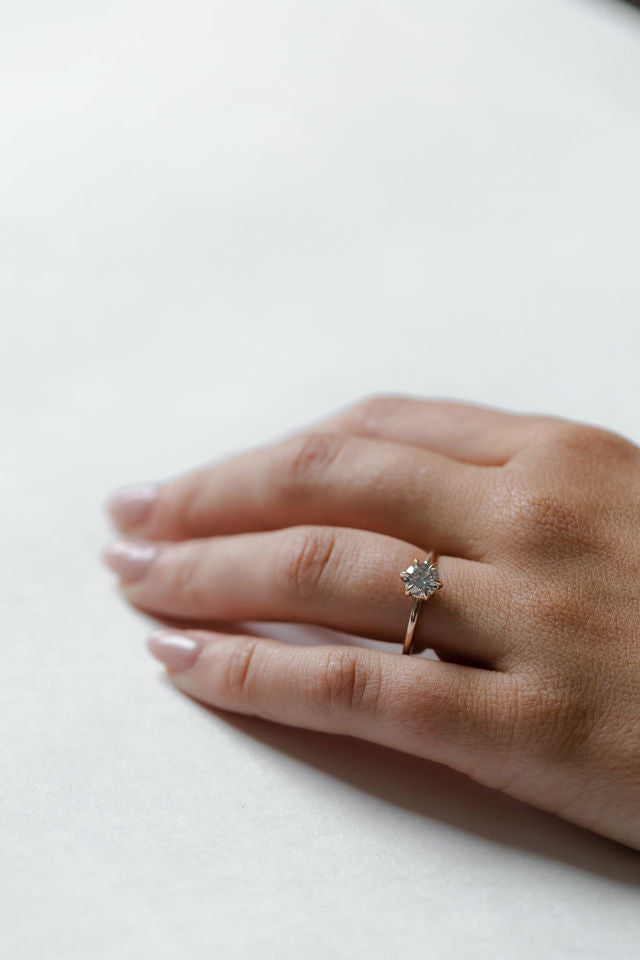 Model wearing the Classic Esther Engagement Ring in yellow gold by Fluid Jewellery 3