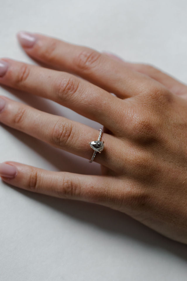 Model wearing the Classic Ivy Engagement Ring in gold by Fluid Jewellery