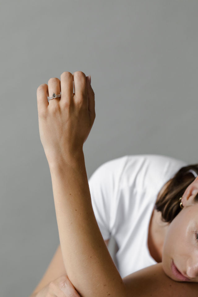 Model wearing the Classic Ivy Engagement Ring in gold by Fluid Jewellery 4