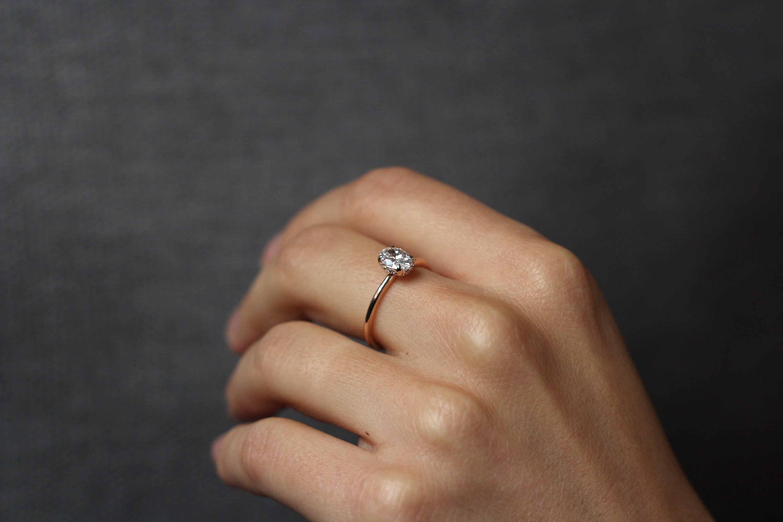 Model wearing the Hidden Halo Love Nest Ring in rose gold by Fluid Jewellery 2