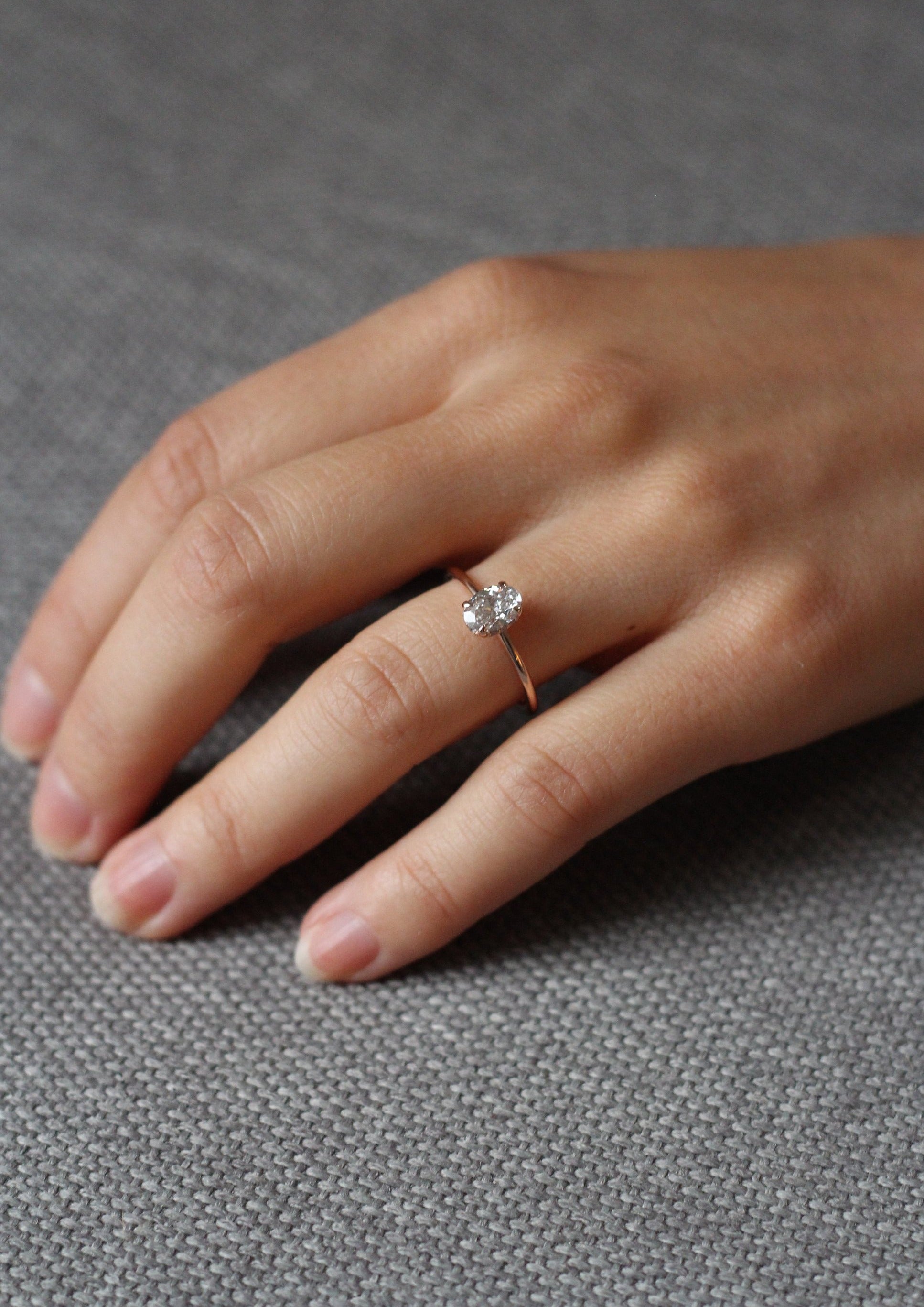 Model wearing the Hidden Halo Love Nest Ring in rose gold by Fluid Jewellery 3