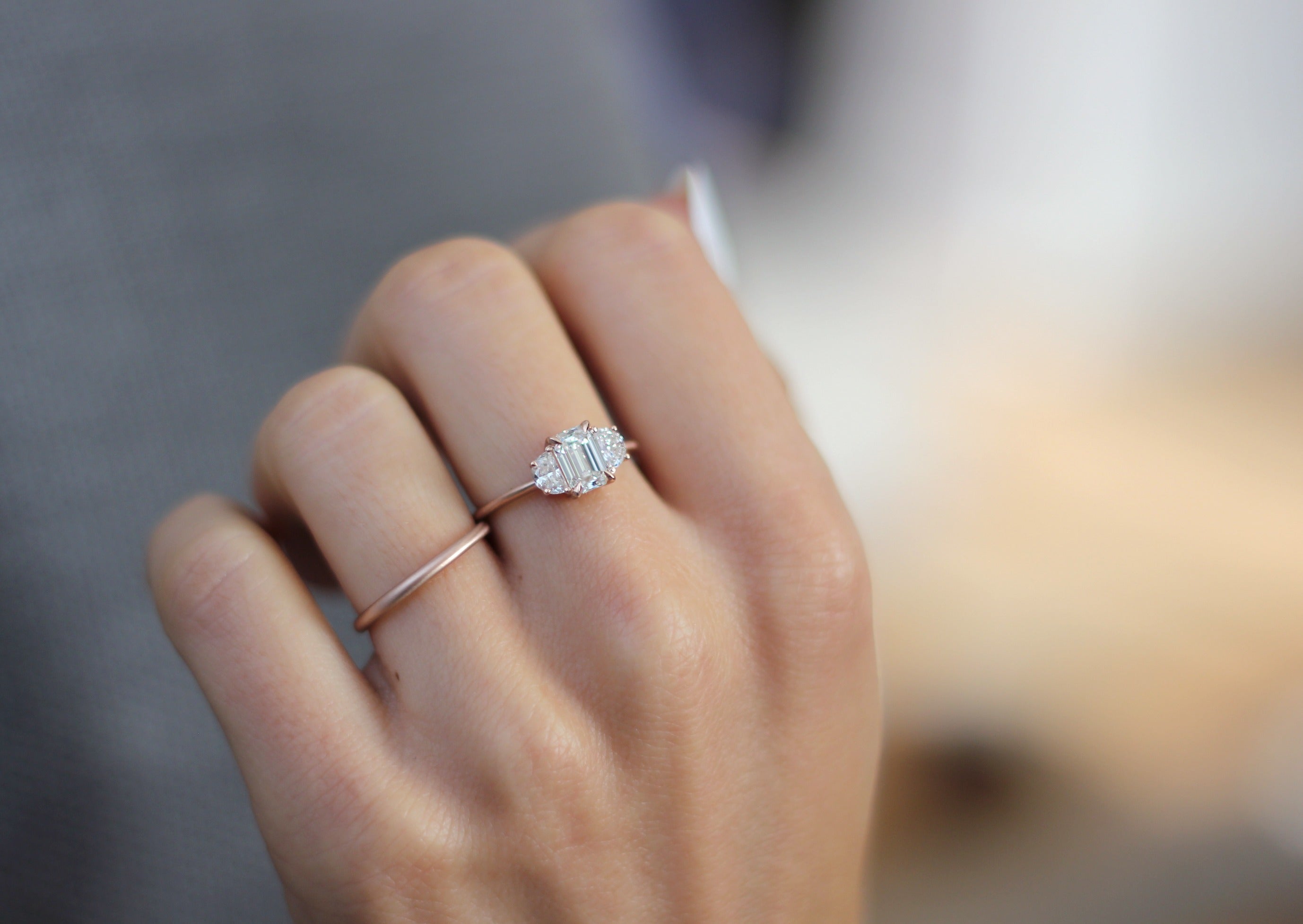 Model wearing the Three Stone Merike Engagement Ring by Fluid Jewellery