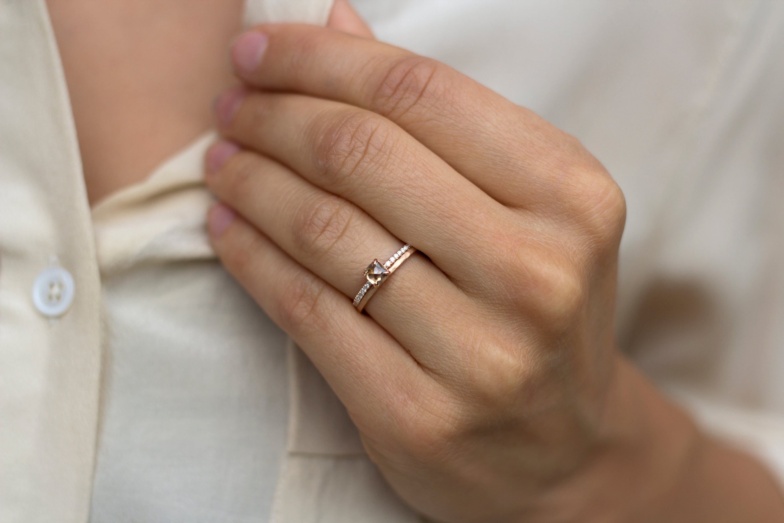 Hand model wearing the Accented Olivia Solitaire Engagement Ring in yellow gold