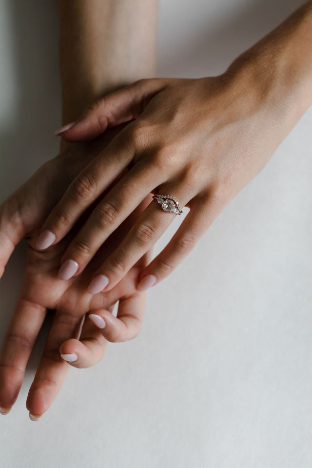 Model wearing the Three Stone Sadie Engagement Ring in yellow gold by Fluid Jewellery 4