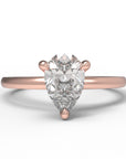 Close up of the Classic Sula Solitaire Engagement Ring in rose gold by Fluid Jewellery