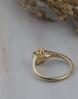 Close-up of the back of the Love Knot diamond solitaire setting showing the hidden halo and spot shank details. 