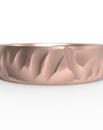 Close up of the mens Wave wedding band in rose gold