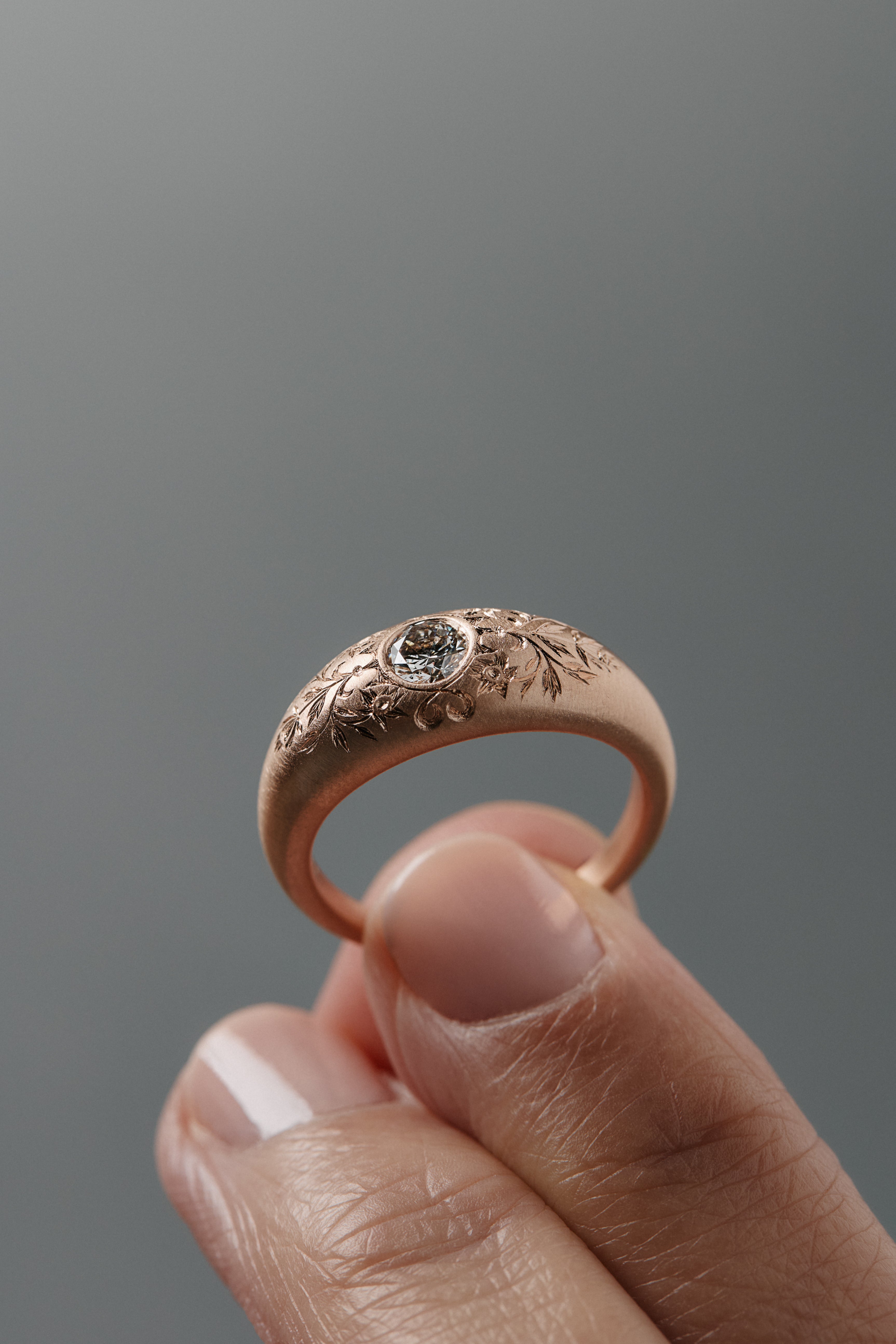 Mrs. Erykah hand-engraved floral bomb engagement ring in Fairmiend gold featuring a Canadian diamond, inspired by Erykah Badu.