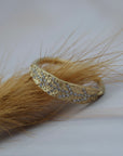 Organic textured leaf wedding ring crafted in Fairmined gold with Canadian diamonds.