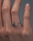Close-up video of a woman wearing the Meghan salt and pepper marquise shaped rose cut cluster engagement ring on her hand.
