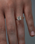 Close-up video of a woman wearing the Asscher cut diamond claw solitaire, showing the stones detail. 