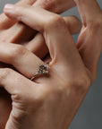 Rebecca three stone engagement  ring featuring a champagne toned move cut diamond accented by white full cut diamonds.