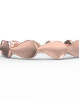 Close up of the Lotus womens wedding band by Fluid Jewellery in rose gold