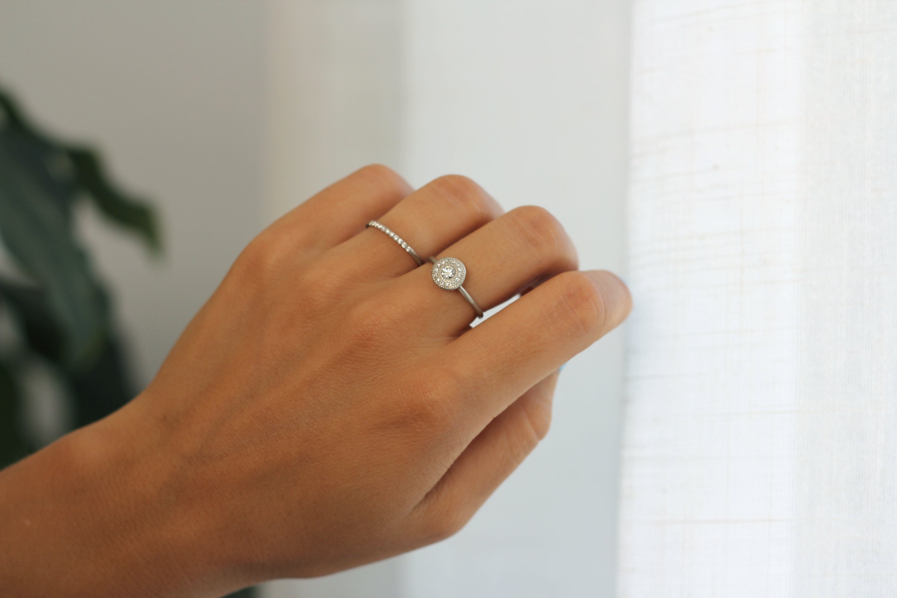 Close up of model hand wearing the Pave Ava womens wedding band by Fluid Jewellery in yellow gold