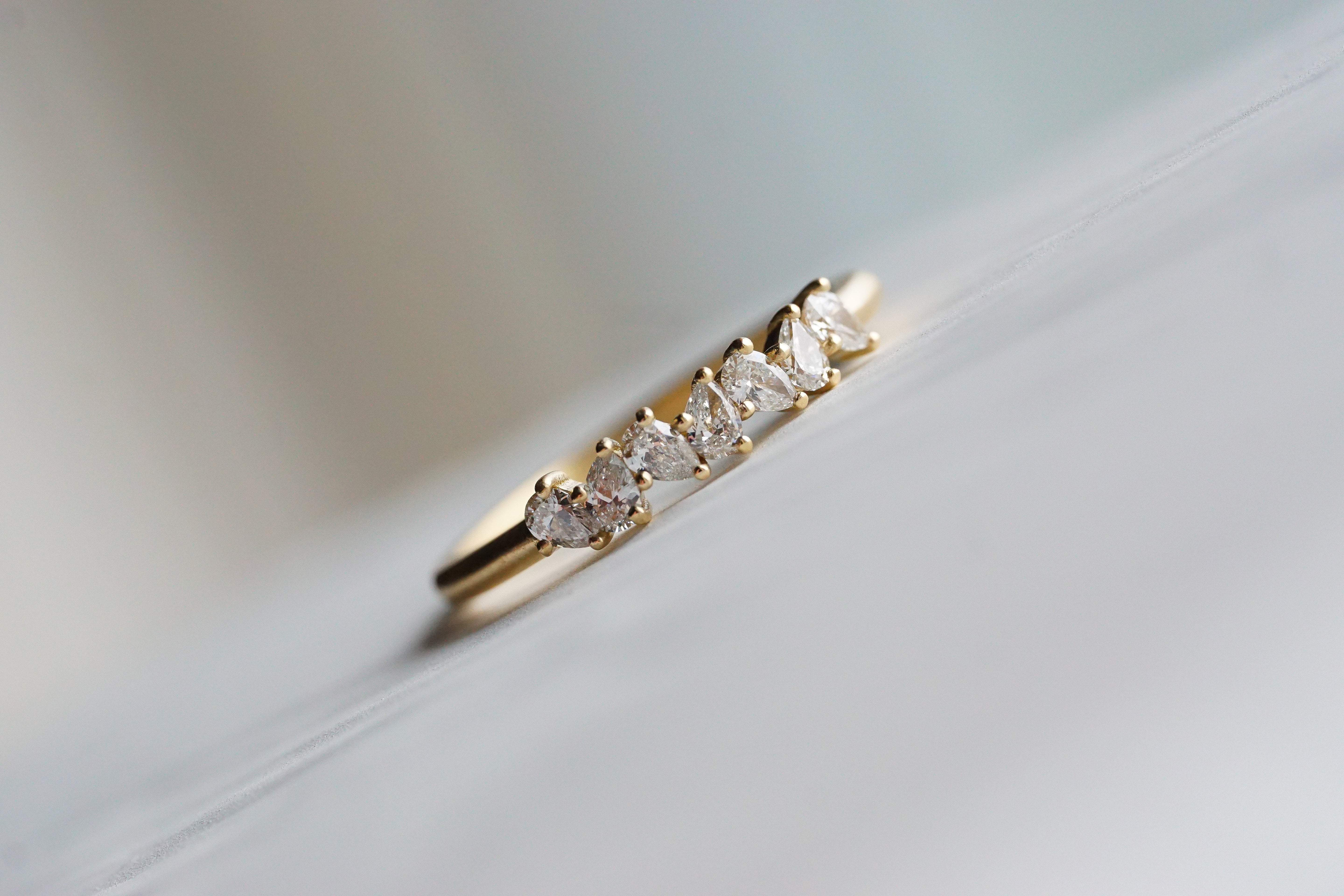 Close up of thecluster Maeve womens wedding band by Fluid Jewellery in yellow gold 4